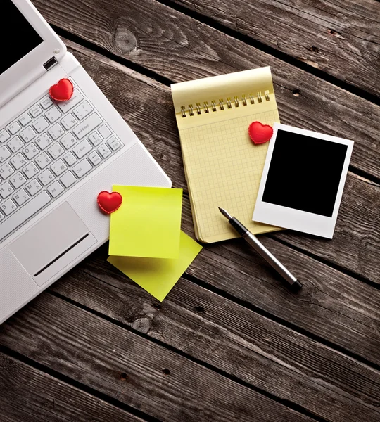 Laptop, instant photo with hearts — Stock Photo, Image