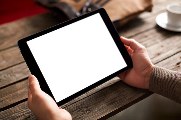 Digital tablet computer in male hands
