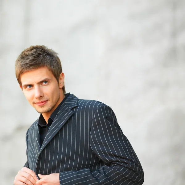 Businessman clasps his suit — Stock Photo, Image