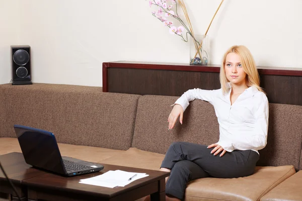 Businesswoman having a rest on the sofa — Stock Photo, Image