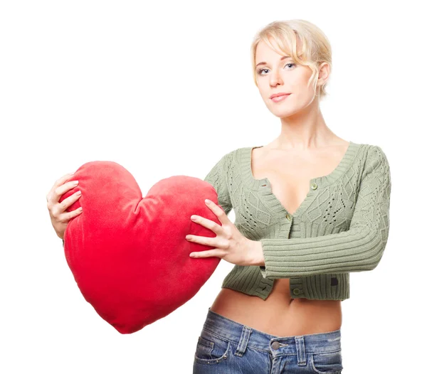 Woman holding a red heart and smiling — Stock Photo, Image