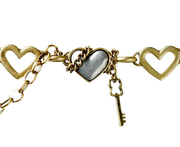 Metallic heart shape and metal key — Stock Photo, Image
