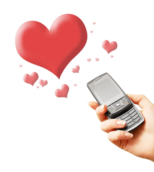 Mobile phone in woman hand and hearts — Stock Photo, Image