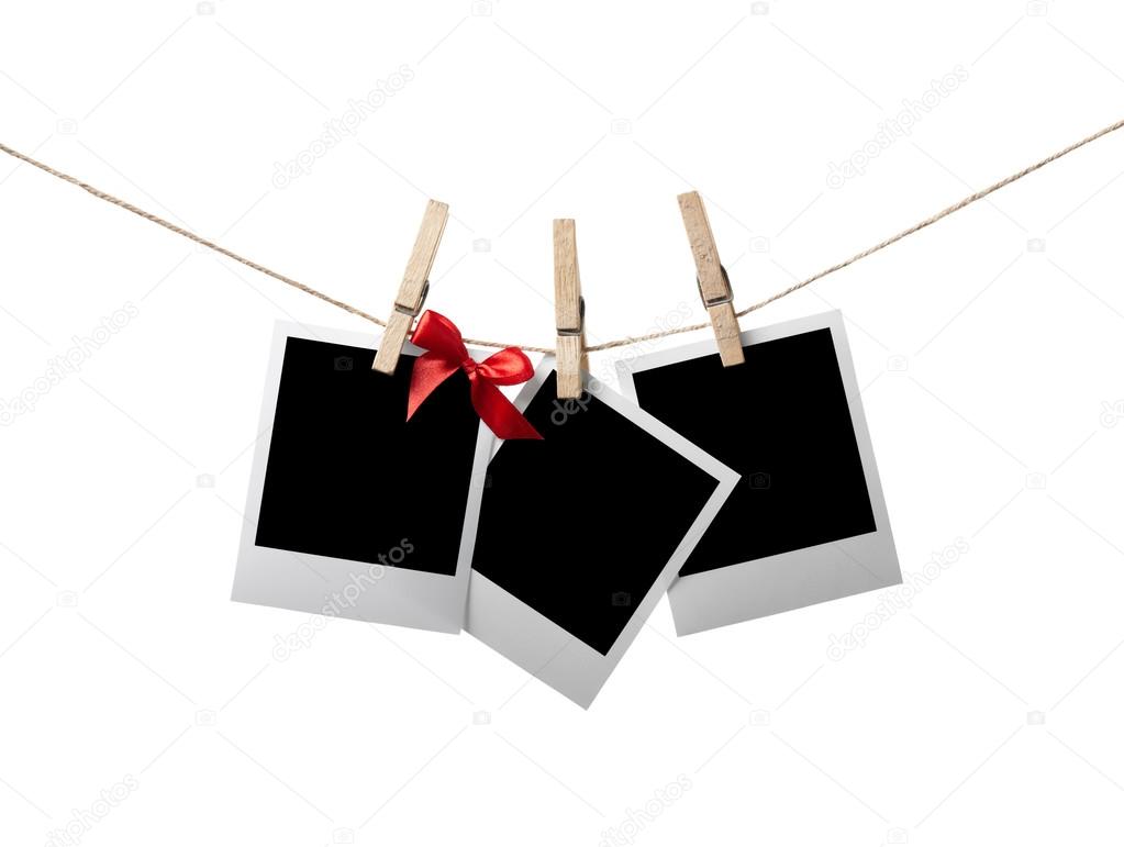 Instant photos with red bow on the clothesline