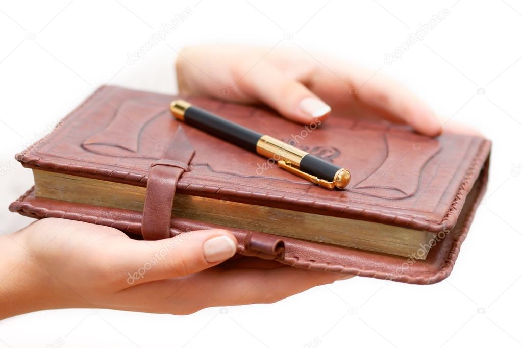 Woman hold diary in hands