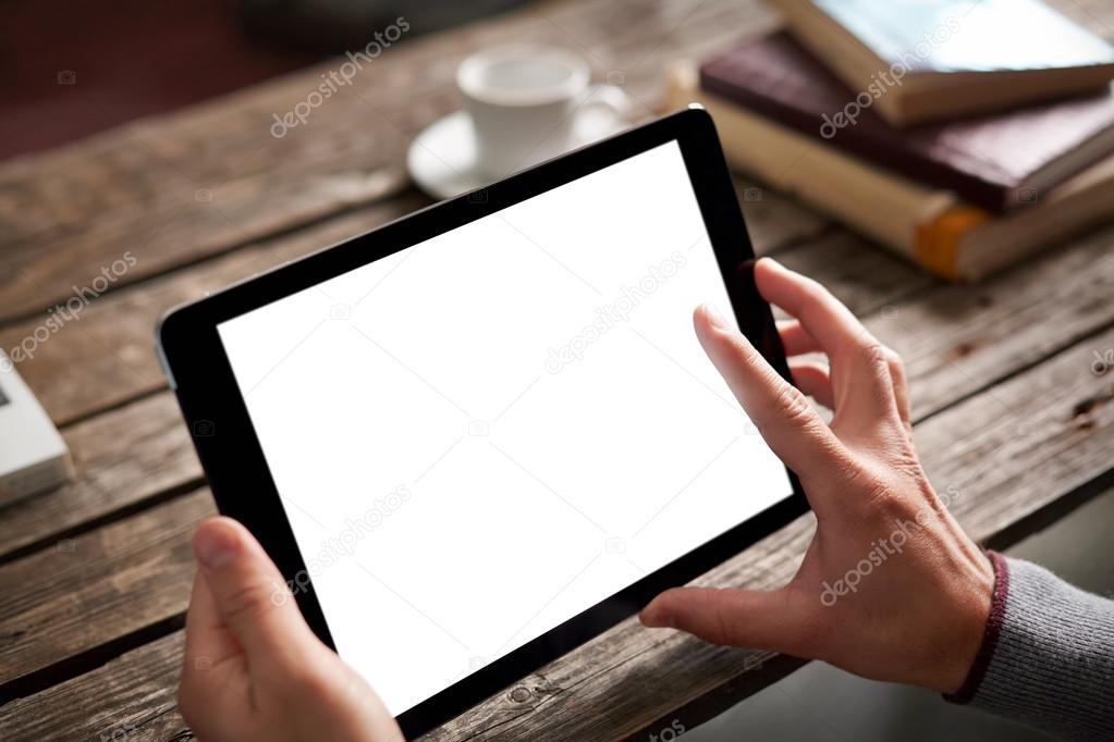 Tablet computer with isolated screen in male hands