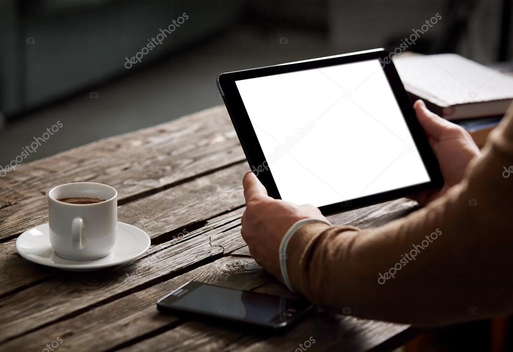 Digital tablet computer in male hands
