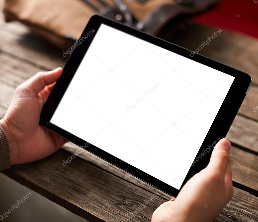Digital tablet in male hands