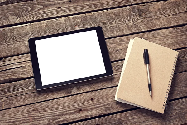 Tablet and notepad on desktop — Stock Photo, Image