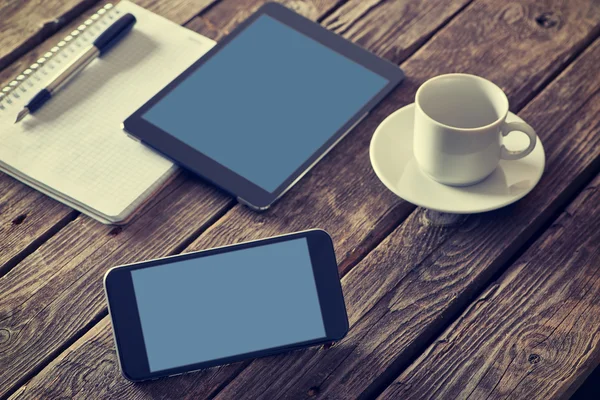 Smartphone and tablet on table — Stock Photo, Image