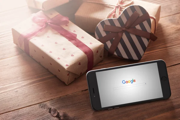 Iphone 6 plus among gift-boxes — Stock Photo, Image