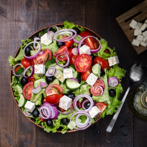 Fresh Greek salad in bowl, still life