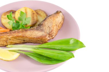 Grilled carp at dish isolated on white