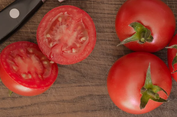 Juicy Cherry tomatoes on wooden background closeup — Stock Photo, Image