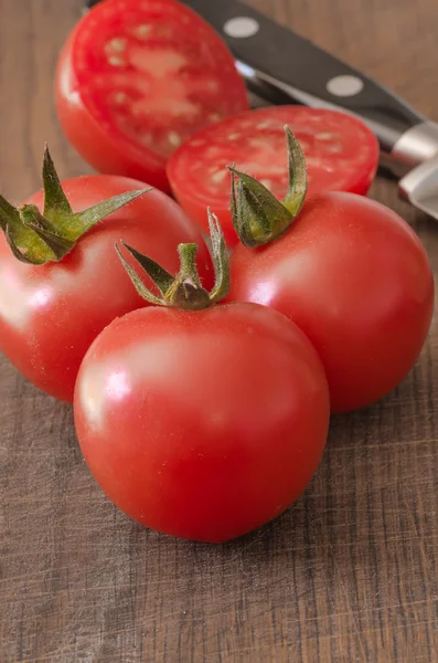 Juicy Cherry tomatoes on wooden background closeup — Stock Photo, Image