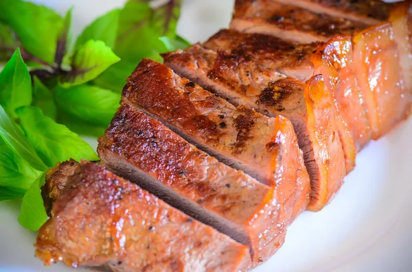 Grilled beef steak with salad and sauce on wooden table — Stock Fotó