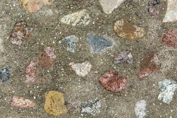 Hintergrund Viele Mit Zement Überzogene Steine Auf Der Straße — Stockfoto