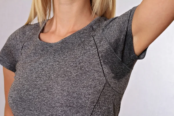Sport woman armpit sweating. Transpiration stain. Hyperthyroidism concept — Stock Photo, Image
