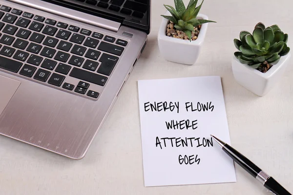 Inspiration motivation quotation Energy flows where attention goes on work desk. Success, Self development concept — Stock Photo, Image