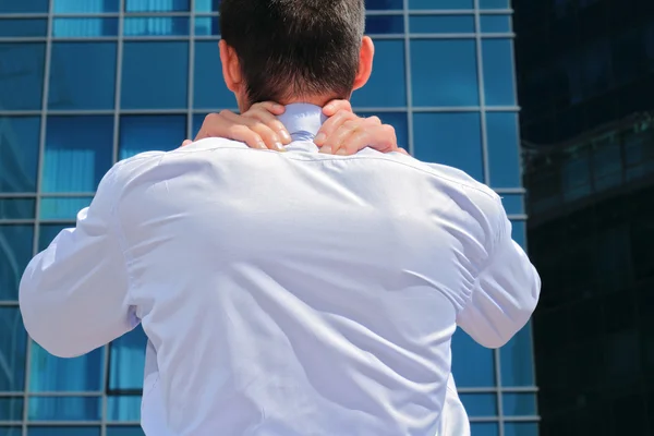 Man with  back pain. Business man rubbing his painful neck — Stock Photo, Image