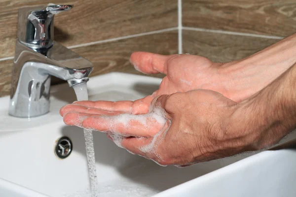 Hygiene concept. Man washing hands close up — Stock Photo, Image