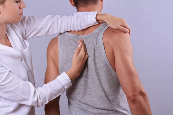 Chiropractic, osteopathy, manual therapy. Therapist doing healing treatment on man's back . Alternative medicine, pain relief concept — Stock Photo, Image