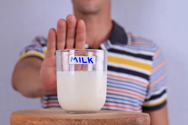 Lactose intolerance. Dairy Intolerant Man refuses to drink milk — Stock Photo, Image