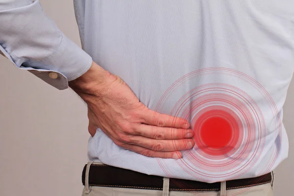 Business man with lower back pain close up. — Stock Photo, Image