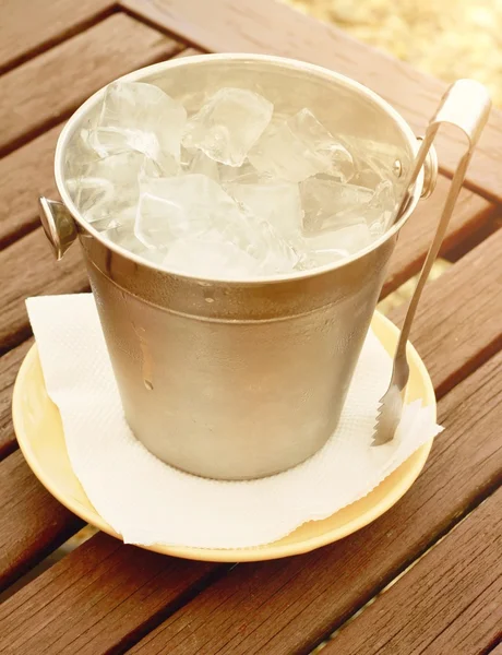 Ice  bucket on wooden table — Stock Photo, Image