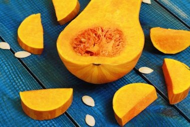 Muscat pumpkin on blue rustic background. Seasons, autumn vegetables