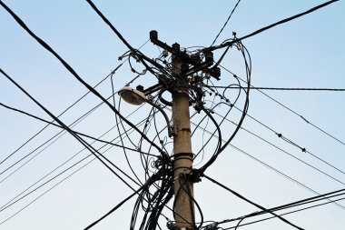 Electricity pole and street light complicated wiring on the pole or theft of power stealing complex
