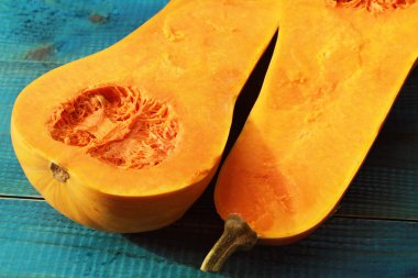 Muscat pumpkin on blue rustic background. Seasons, autumn vegetables