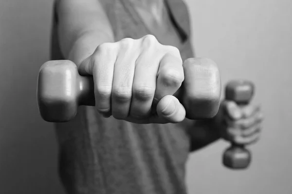 Sport, fitness ,workout concept. Close-up of young woman hand with dumbbell,weghts