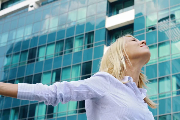 Young professional , attractive, blonde business woman raising hands celebrating success. Winner, success, freedom concept — Zdjęcie stockowe