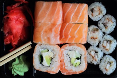Philadelphia sushi roll with raw salmon and unagi roll  with fresh water Eel.  Japanese cuisine, restaurant. Healthy life style,  diet food. Fish dishes, omega 3 oil