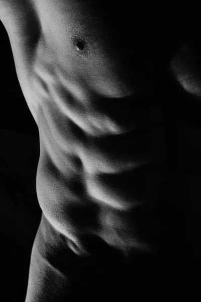 Close-up of perfect male abs, body, low key image. Man, sport, power, muscle — Stockfoto