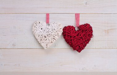 Love concept. Two Hearts  decoration over white wooden russtic b