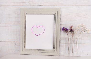 Love concept. Heat shape Poster in frame, rustic , shabby chic, vintage style. Scandinavian style home interior decoration.