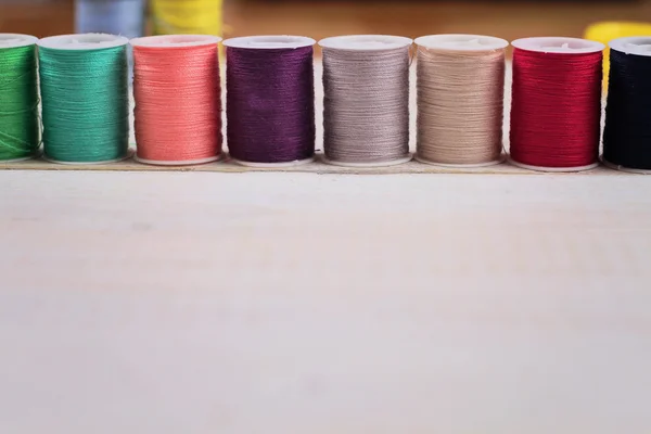 Sewing thread and accessories on white background. — Zdjęcie stockowe