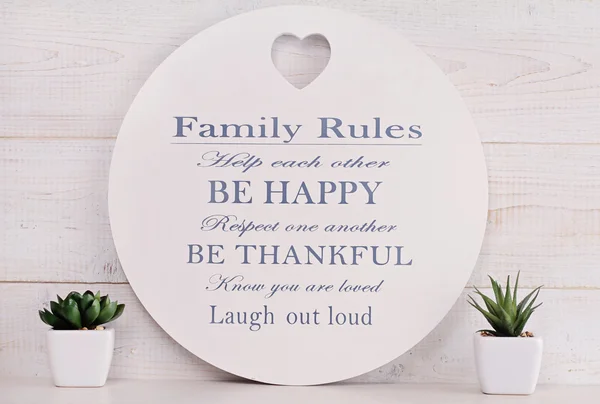 Happy family, Love and togetherness concept. Family rules sign. 图库图片
