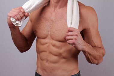 Close up of Strong muscular male torso showing six pack abs.  Bodybuilding, work out, sport, hard work, motivation, active lifestyle concept