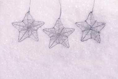Snowflakes christmas tree decoration on white snow background.  New, year, winter holidays, abstract seasonal background