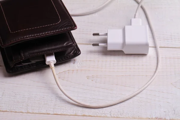 Wallet and charger. Making money, money attraction finance concept — Stock Photo, Image
