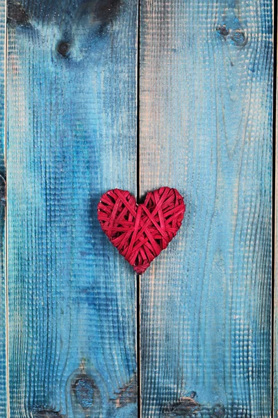 Love concept. Red heart over blue rustic wooden background wooden background. Valentine's Day  poster or postcard design. Vintage image — Stock Photo, Image