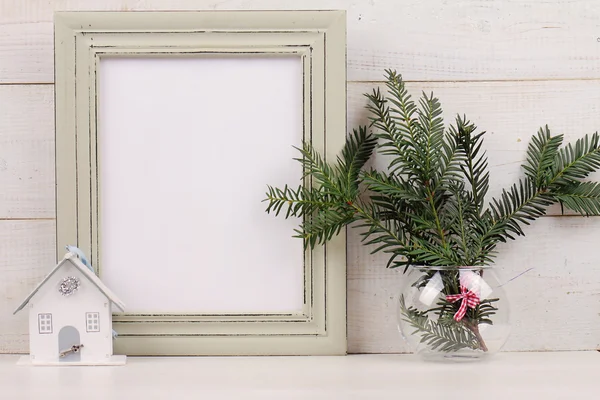 Christmas and New Year background. Empty picture frame,  fir branch and on white background. Copy space image. Scandinavian style home interior decoration — Stock Photo, Image