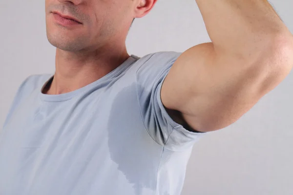 Sport man armpit sweating. Transpiration stain. Hyperhidrosis concept — Stock Photo, Image