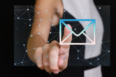 Internet, Business Solutions  and technology concept. Business woman pressing Mail button on virtual screen.