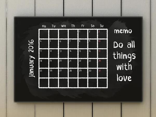 Inspiration motivation quotes calendar. January motto Do all things with love. Calendar january 2016 on blackboard written with chalk.