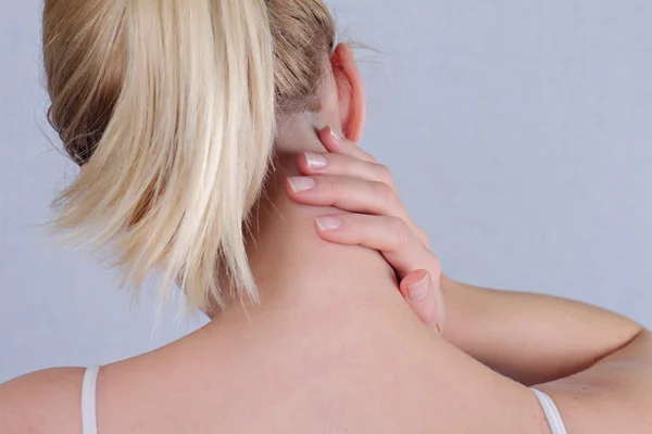 Woman with neck pain close up. Pain relief concept — 图库照片