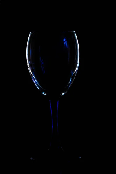 Glass fuselage with multicolored glare of light on a dark background — Stock Photo, Image